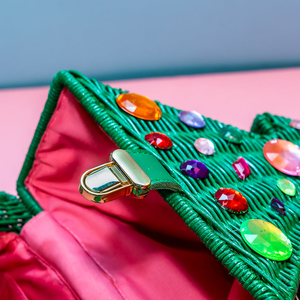 Wicker darling bejewelled christmas tree bag purse sits in a colourful set.