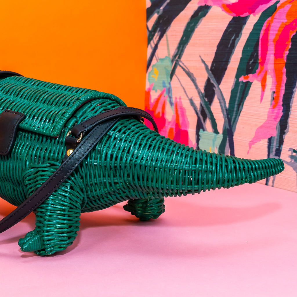 The tail of the crocodile handbag has a dramatic curve to it.