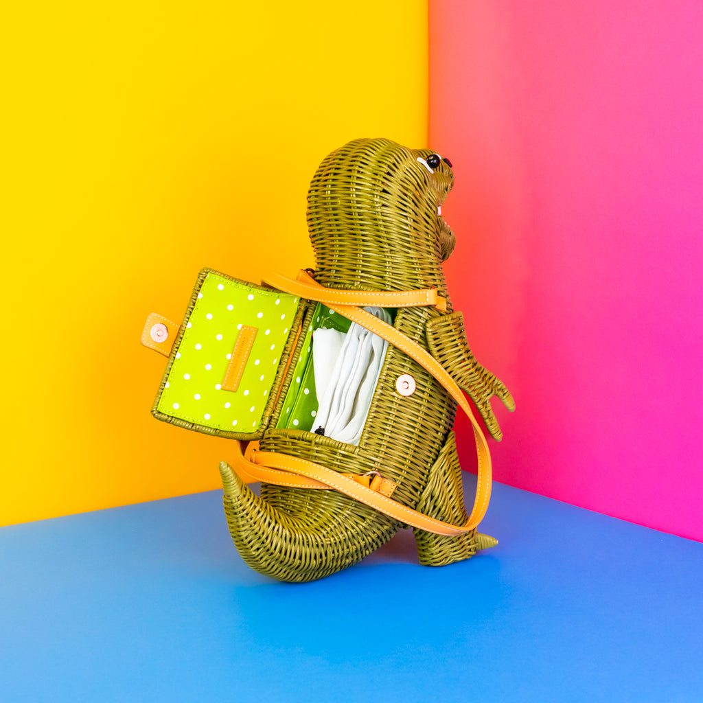 Another view of the t-rex handbag's open compartment. 