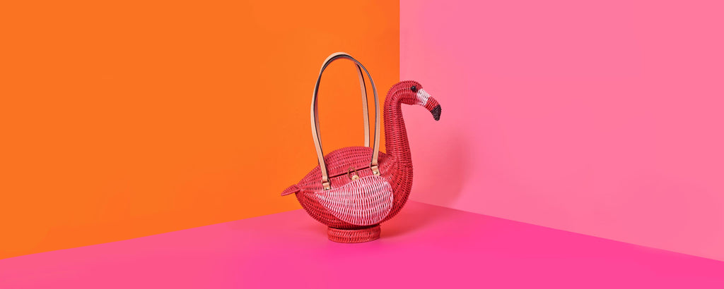 Wicker Darling monty flamingo shaped bag handbags online Australia sits in a colourful pink background
