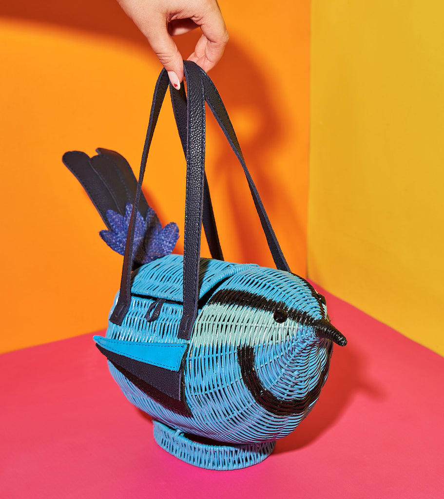Animal shaped purse Wicker Darling lawren bagall blue breasted fairywren bird shaped bag sits in a colourful background