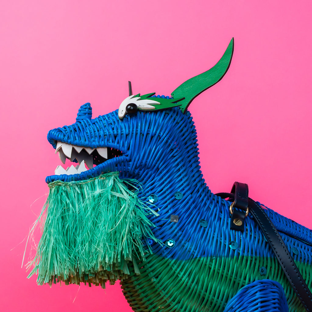 Xiang limited edition dragon purse dragon handbag features custom sequin embellishment and is styled in a pastel coloured room. 