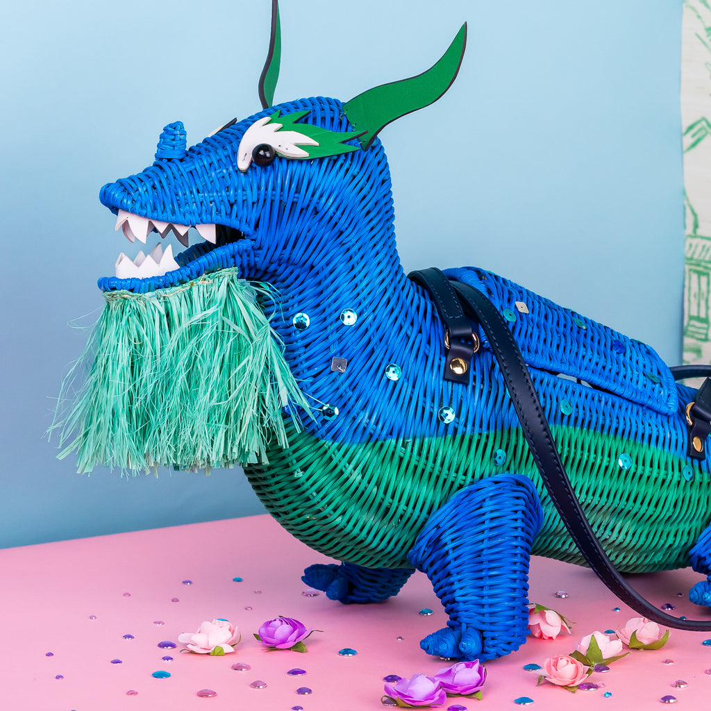 Xiang limited edition dragon purse dragon handbag features custom sequin embellishment and is styled in a pastel coloured room. 