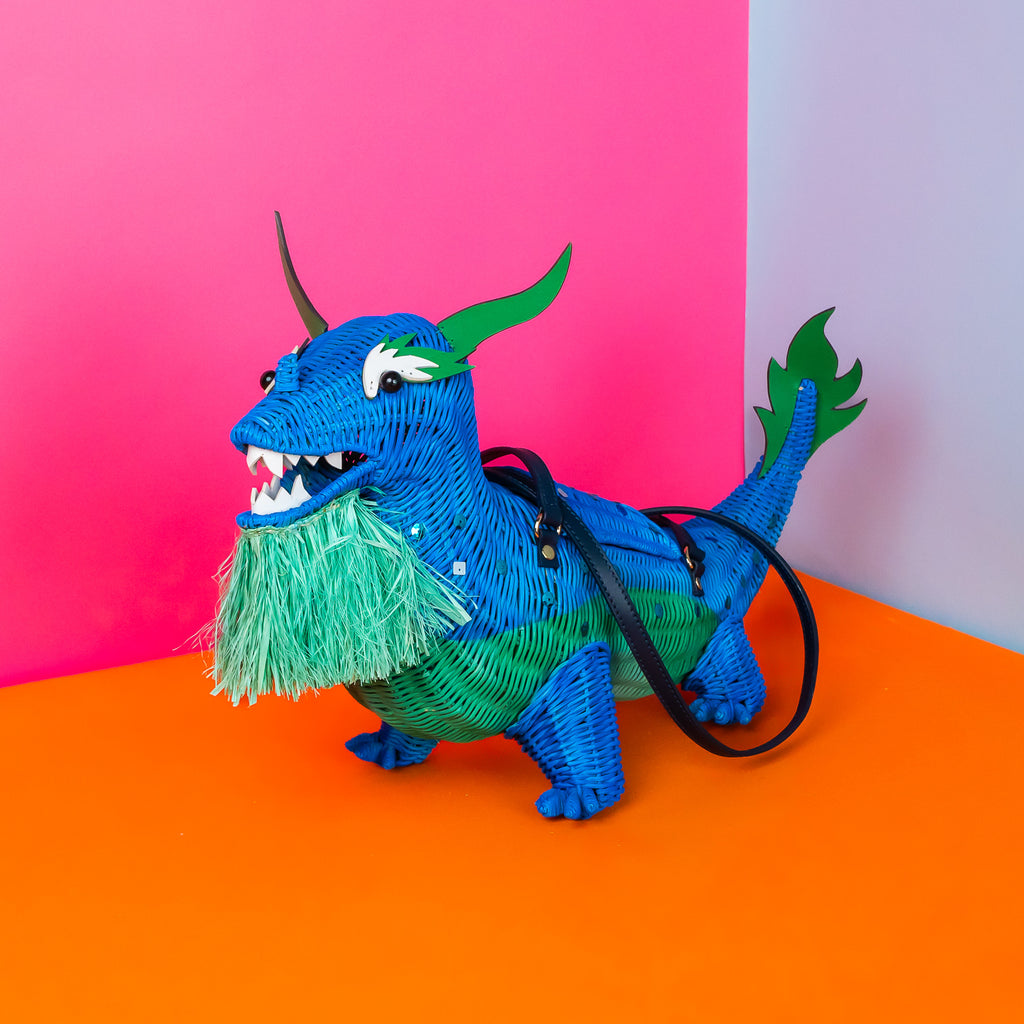 Xiang limited edition dragon purse dragon handbag features custom sequin embellishment and is styled in a pastel coloured room. 