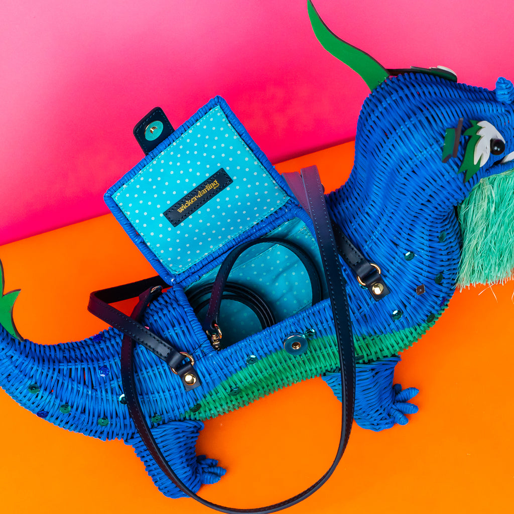 Xiang limited edition dragon purse dragon handbag features custom sequin embellishment and is styled in a pastel coloured room. 