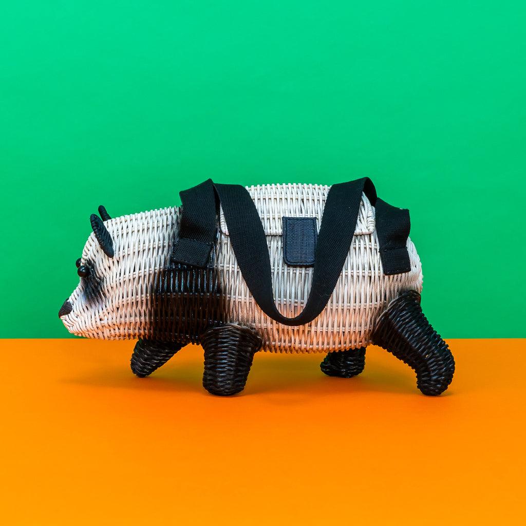 Side view of a panda shaped, rattan handbag from Wicker Darling.