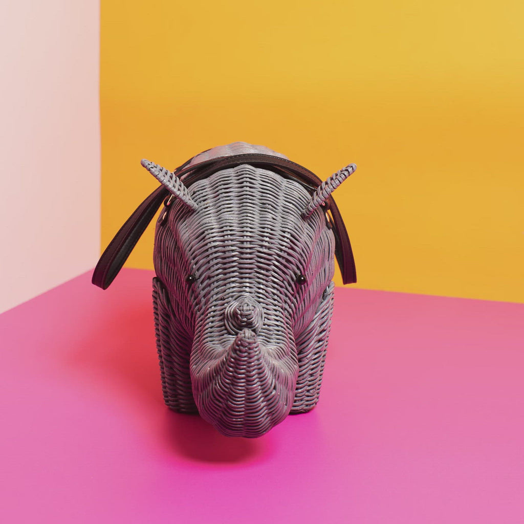 Wicker Darling Rhino purse rhino shaped bag rotates in a colourful room
