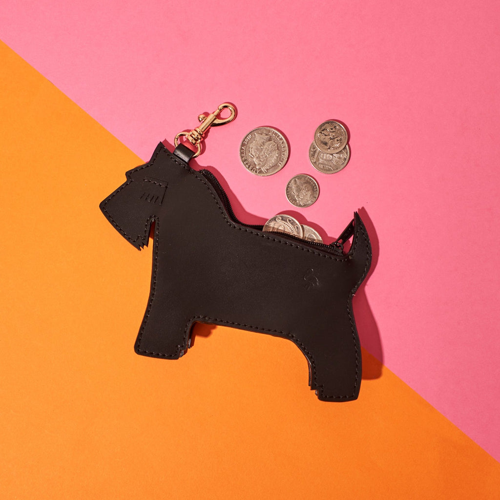 wicker darling Scottish terrier leather coin purse scottie bag sits in a colourful room