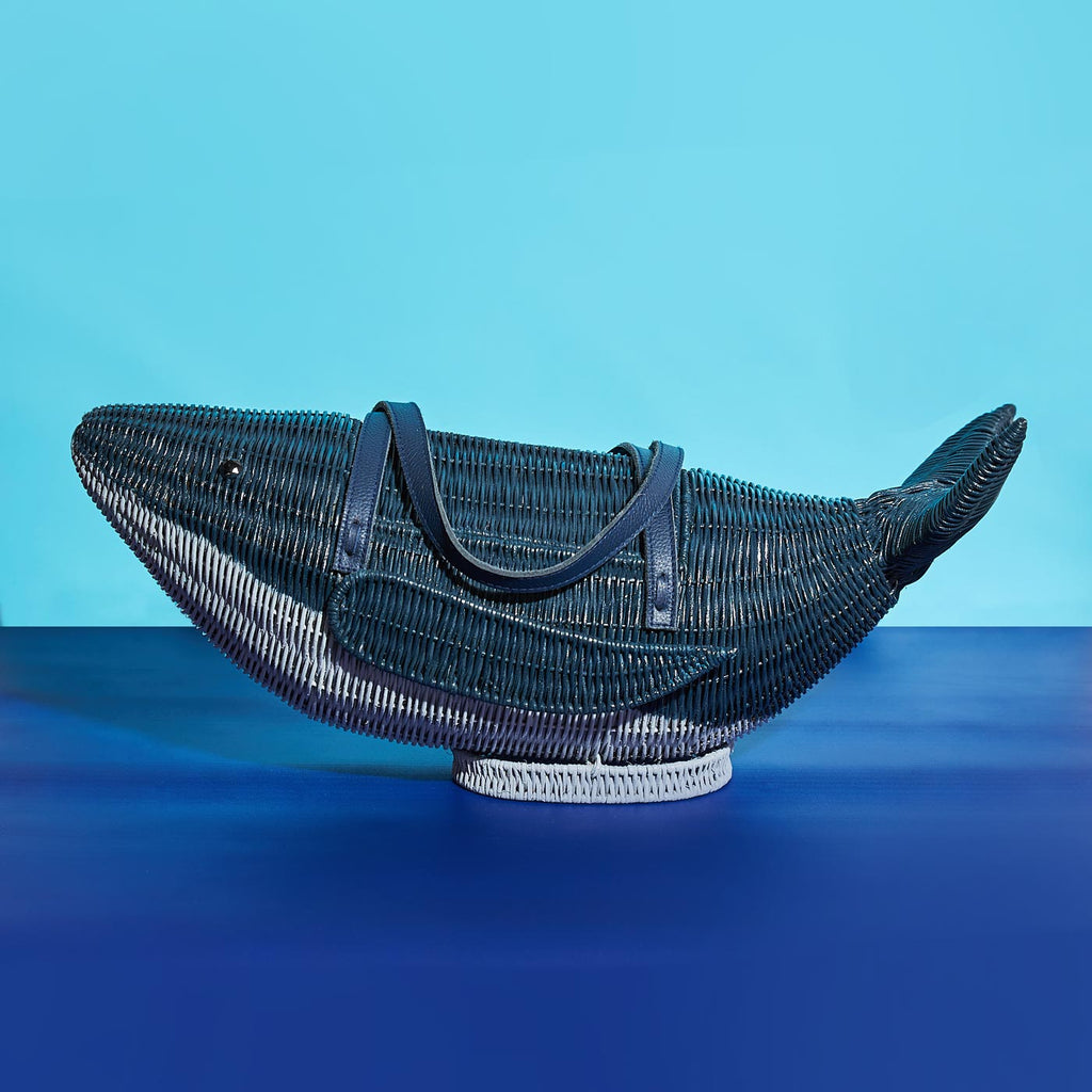 Wicker Darling moby wick whale purse blue whale wicker basket in a blue background