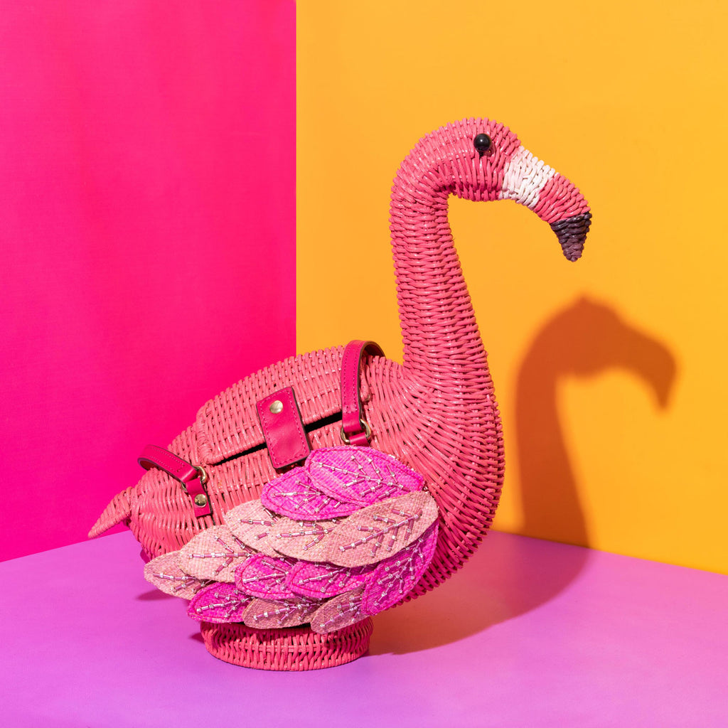 Wicker Darling annie Flamingo purse embroidered bird purse sits in a colourful background