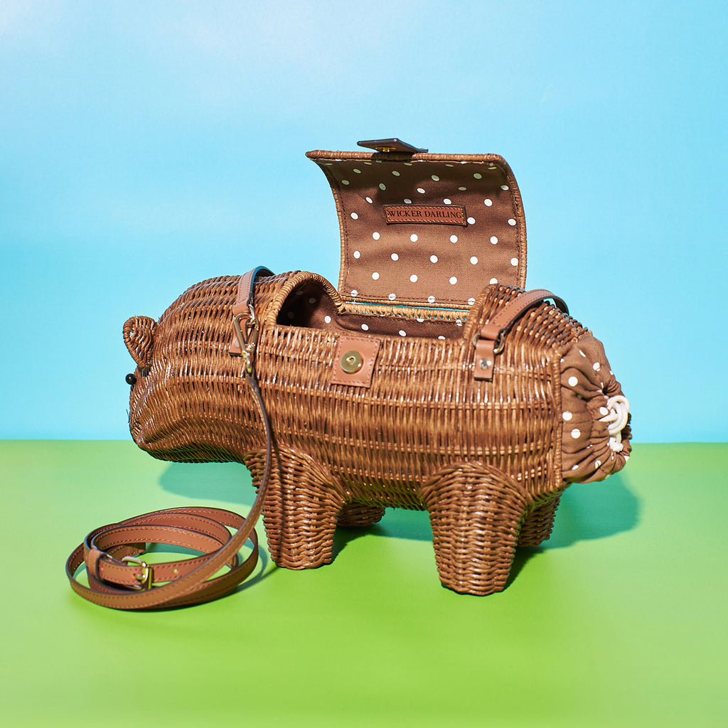 Wicker Darling cutest wombat bag australiana handbag sits in a colourful room