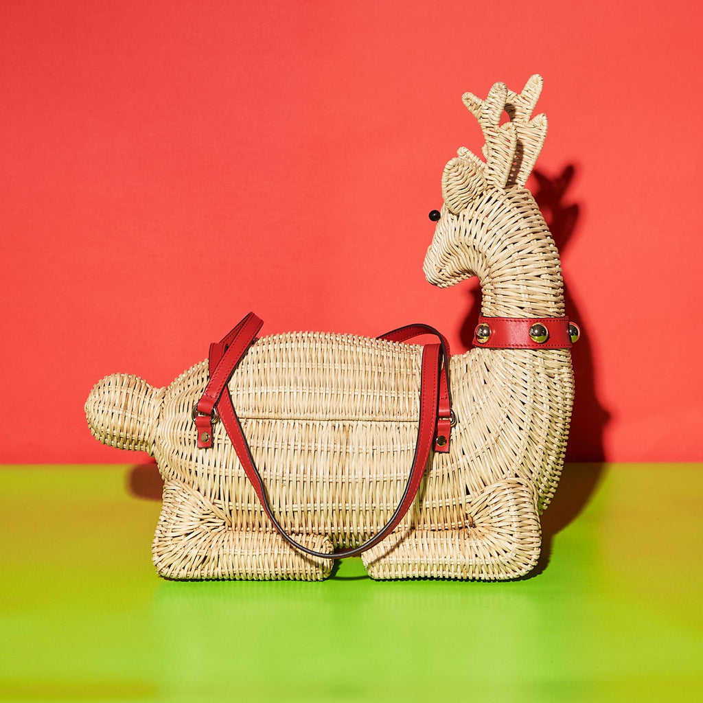 Wicker Darling jingle bell reindeer bag holiday purse in festive christmas background