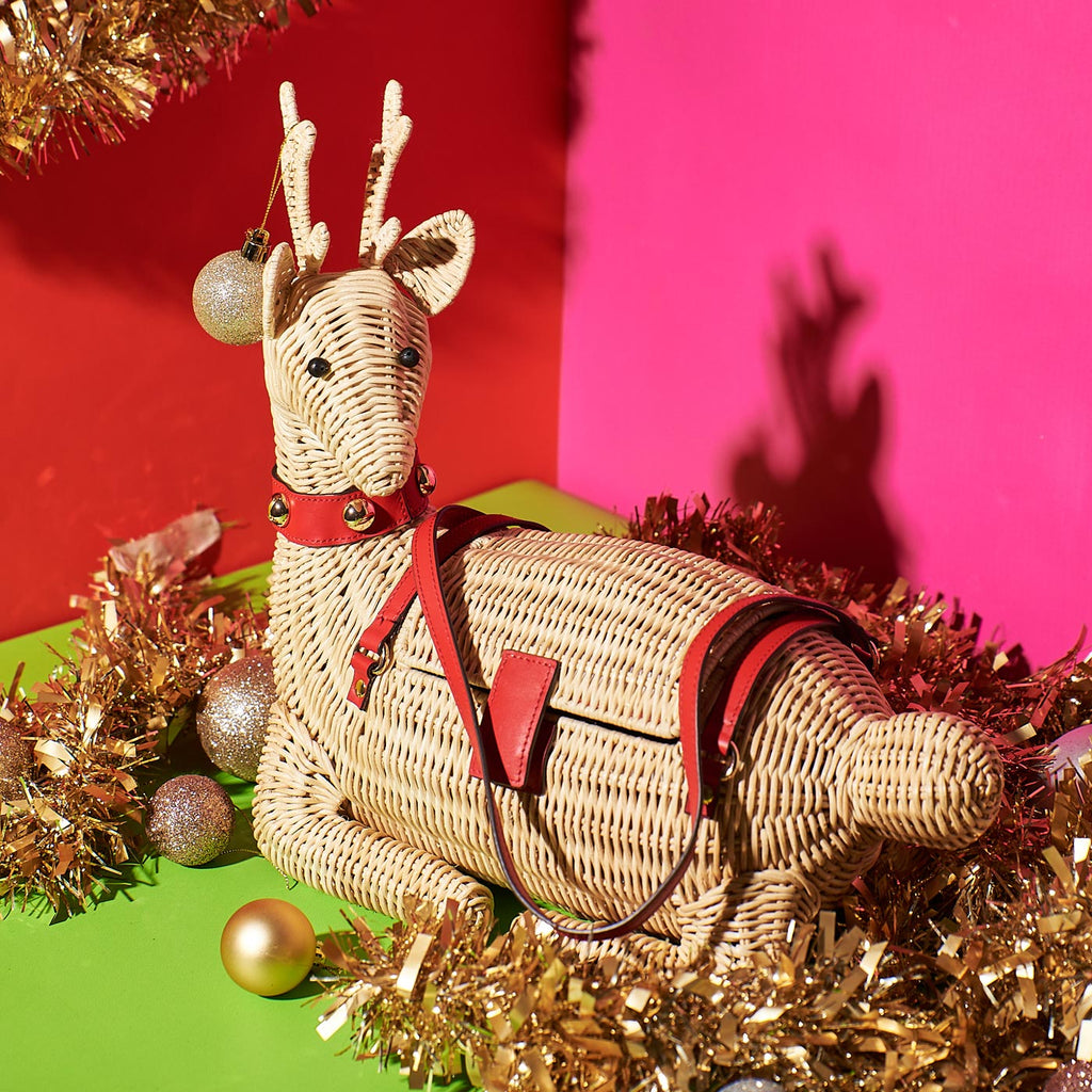 Wicker Darling jingle bell reindeer bag holiday purse in festive christmas background