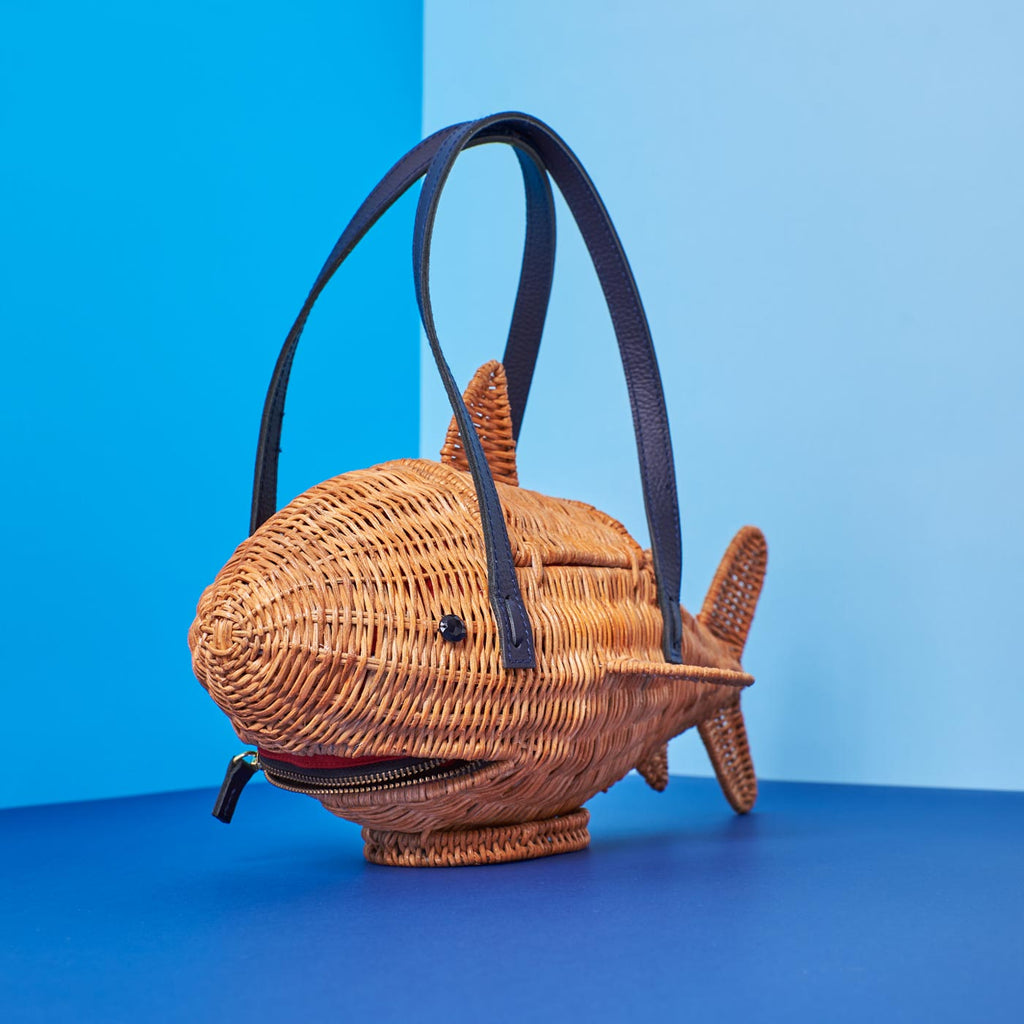 Wicker Darling marcus the sharkus shark purse marcus darling sits in a blue space