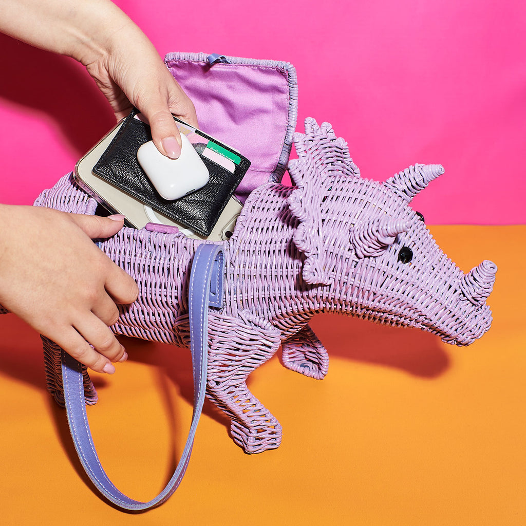 Wicker Darling patricia triceratops purple dinosaur wicker handbag dinosaur purse in a colourful background