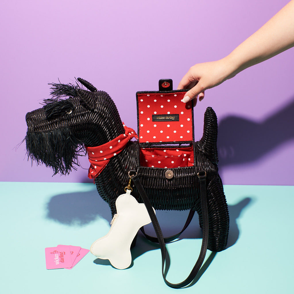 Wicker Darling scottie scotish terrier bag scottie purse sits in colourful background