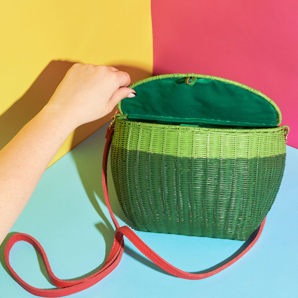 Wicker Darling mini watermelon shaped purse watermelon bag sitting in a colourful backkground